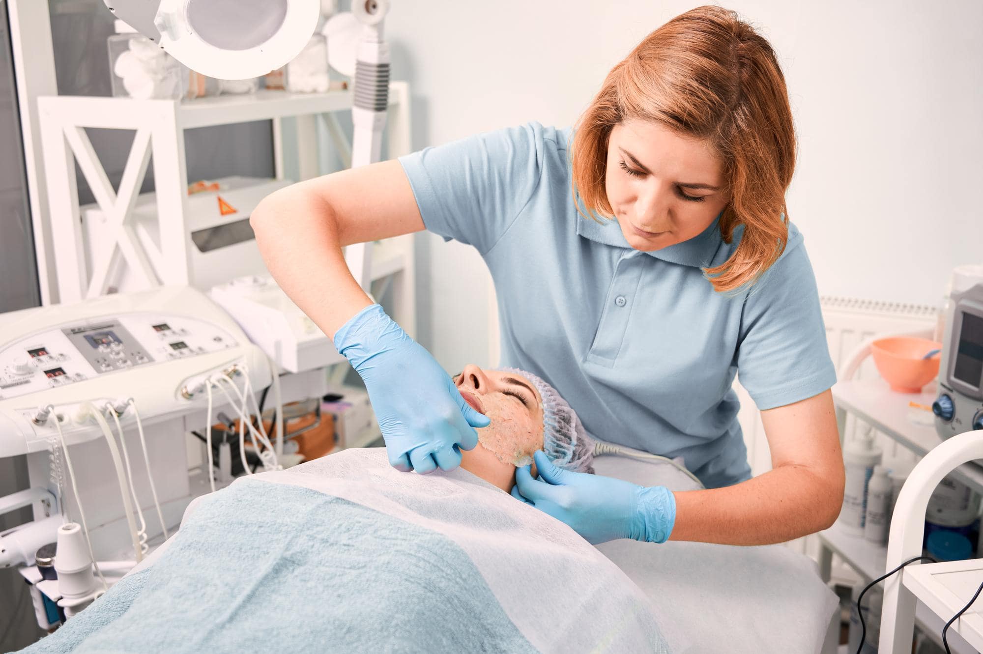 Aesthetic nurse in Northern Ireland providing non-surgical cosmetic treatment to a client.